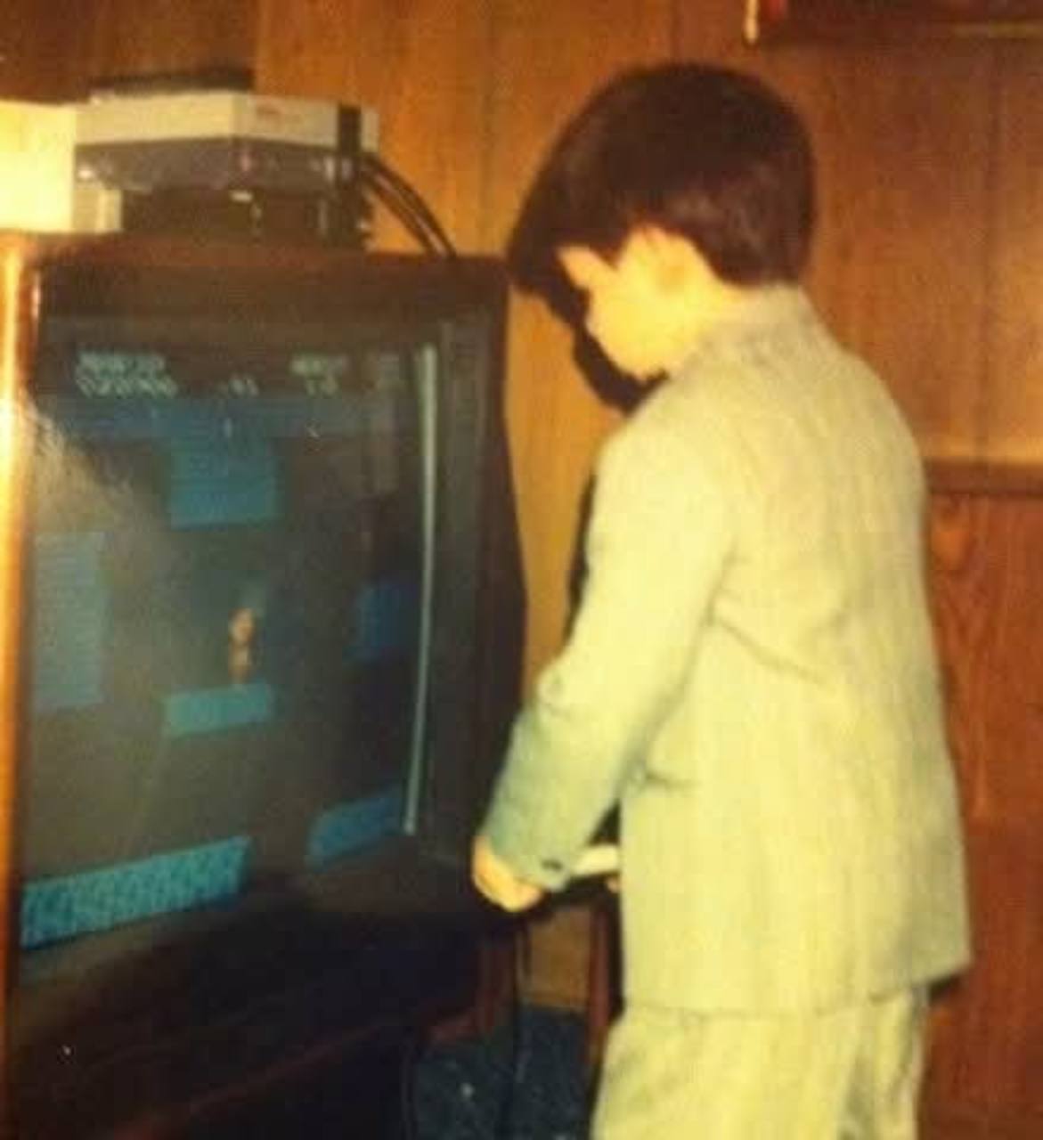 Christopher Morgan playing a video game as a child